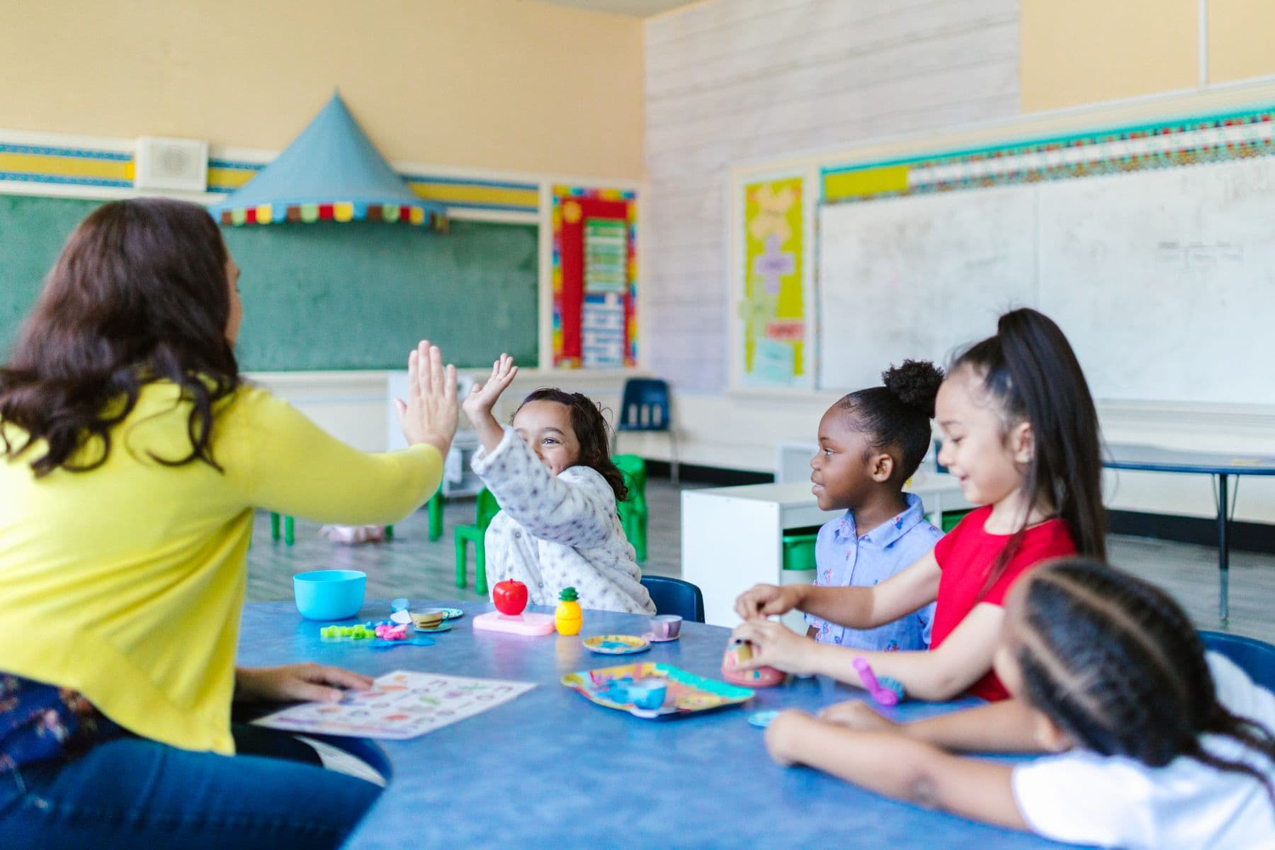 Children learning with their teacher at a daycare center
